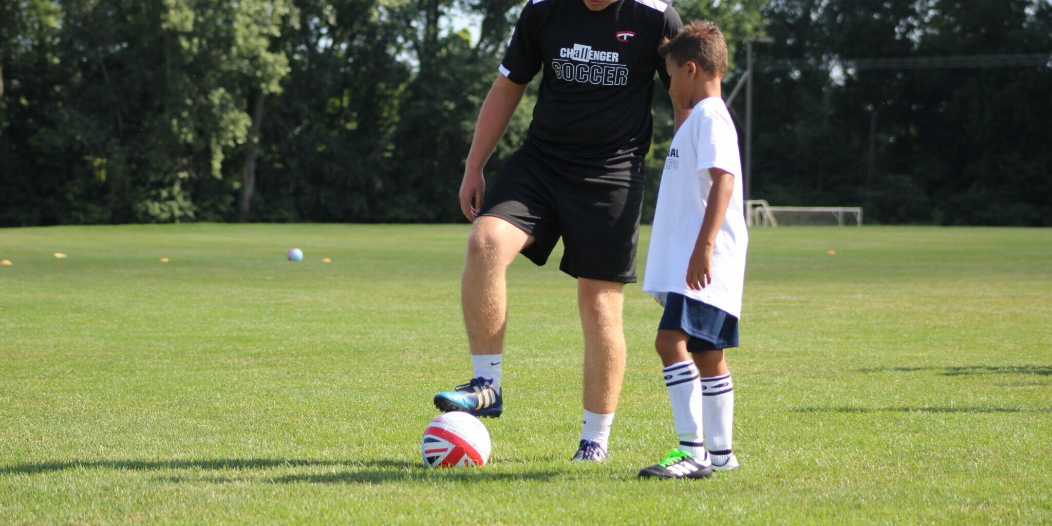 Coach one on one training with young player Coach one on one training with young player