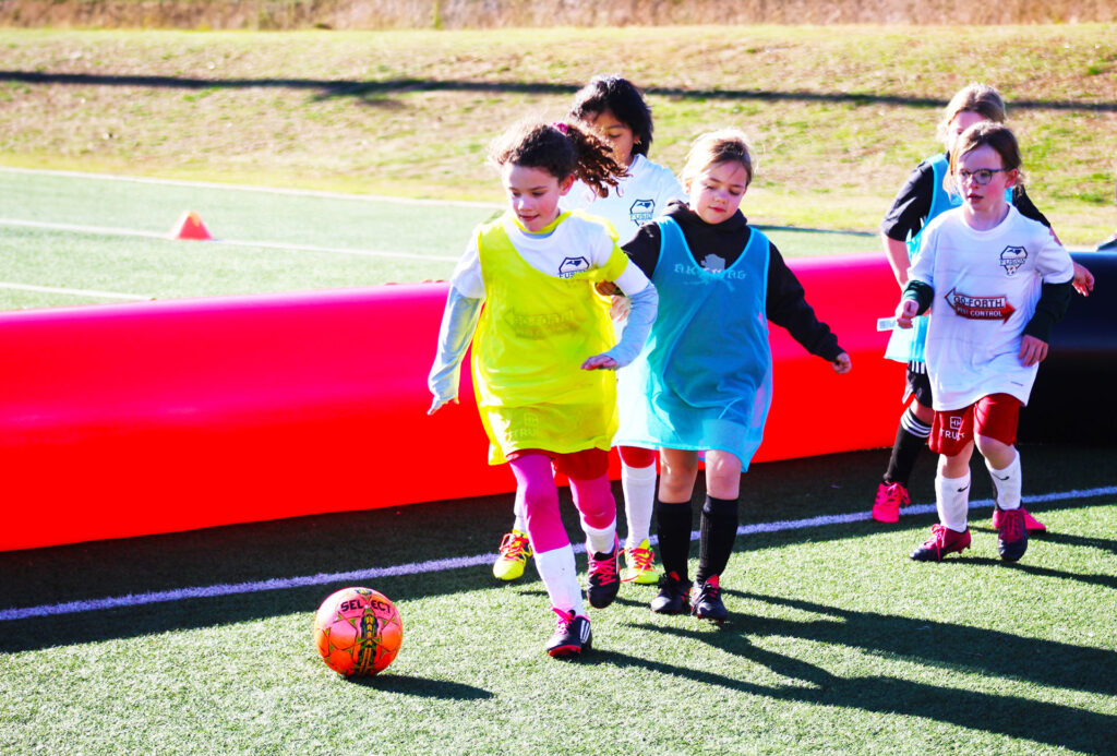 Soccer Players Girls Playing in the Challenger Sports 3v3 Inflatable Soccer Fields