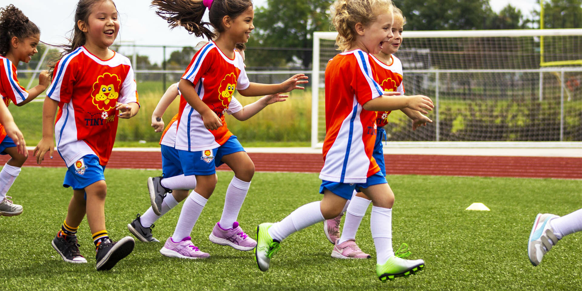 TinyTykes Young Players Running and Having Fun TinyTykes Young Players Running and Having Fun